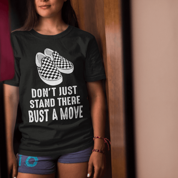 Female Standing in front of mirror wearing a Don't just stand there bust a move T-shirt from the xpert apparel store  