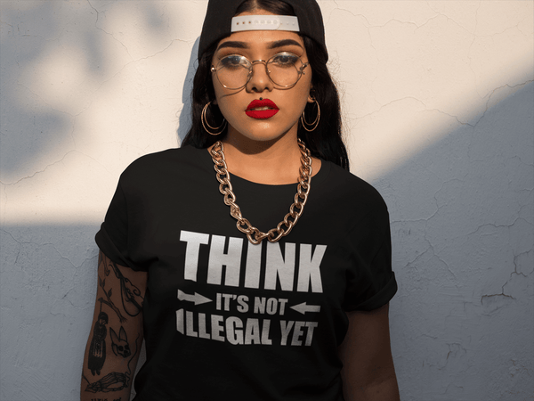 Latina Lady pose in Black T-shirt with "Think It's not Illegal Yet" design from the Xpert Apparel Store