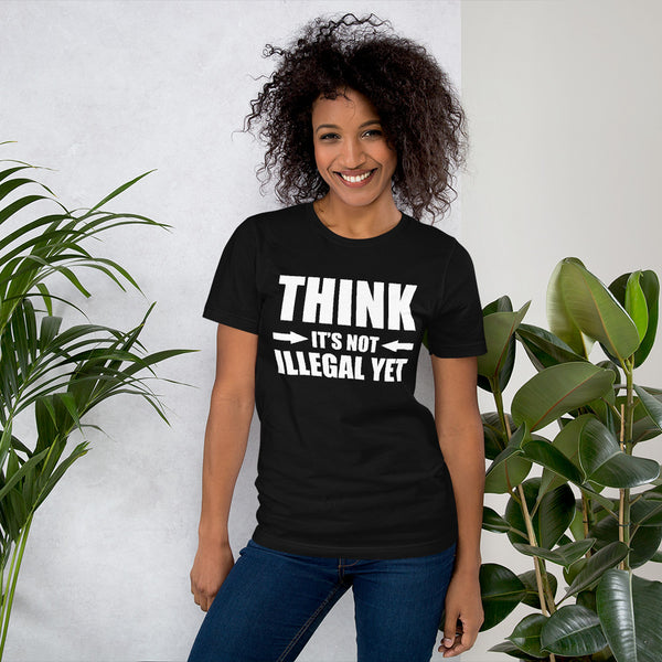 Woman Poseing in front of potted plants wearing all black T-shirt with "Think It's not Illegal Yet" design
